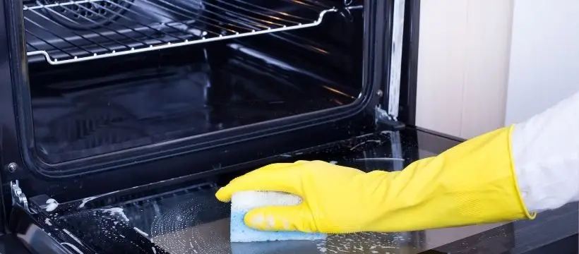 Cleaning the inside of an oven.