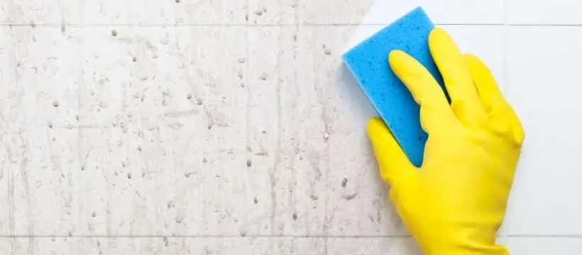 Deep cleaning a hand with a sponge.